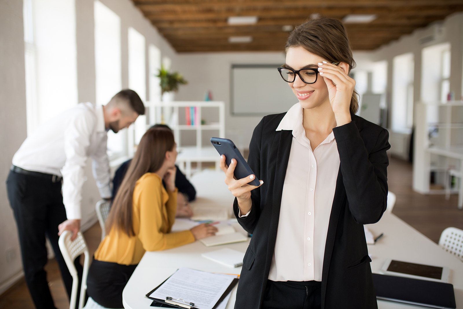 young-smiling-business-woman-in-eyeglasses-and-3RDCAXL.jpg